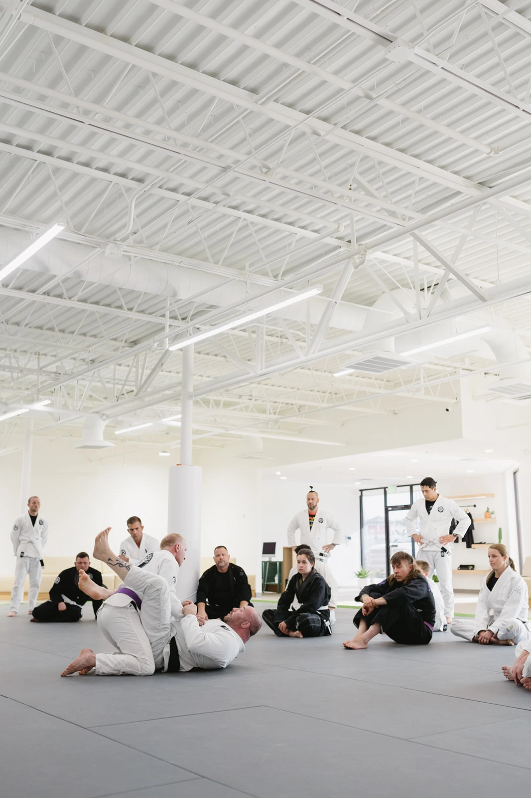 BJJ practitioners training submissions at Method Jiu-Jitsu in Tulsa
