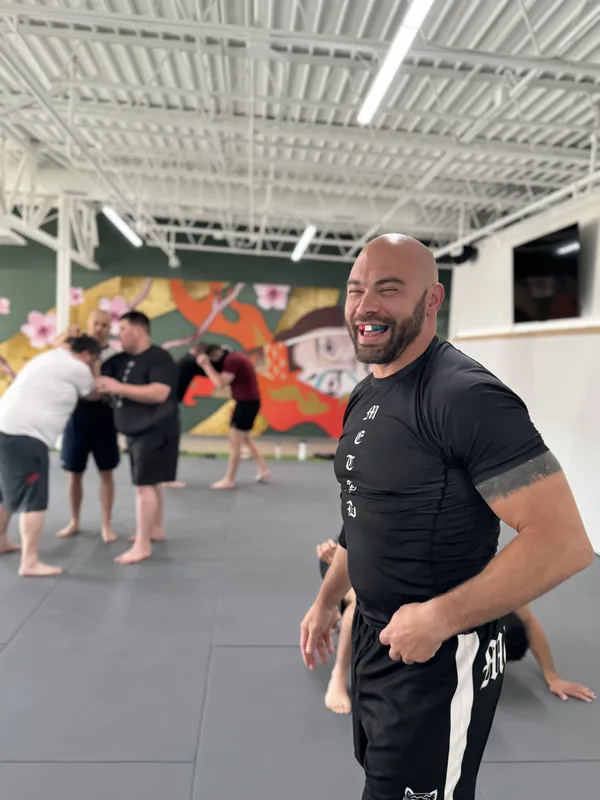 Two grapplers training a no-gi guard pass at Method Jiu-Jitsu in Tulsa, Oklahoma